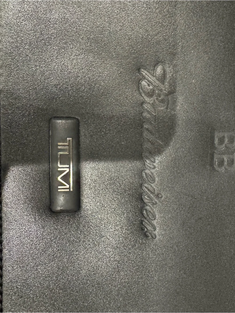 Tumi sleek leather